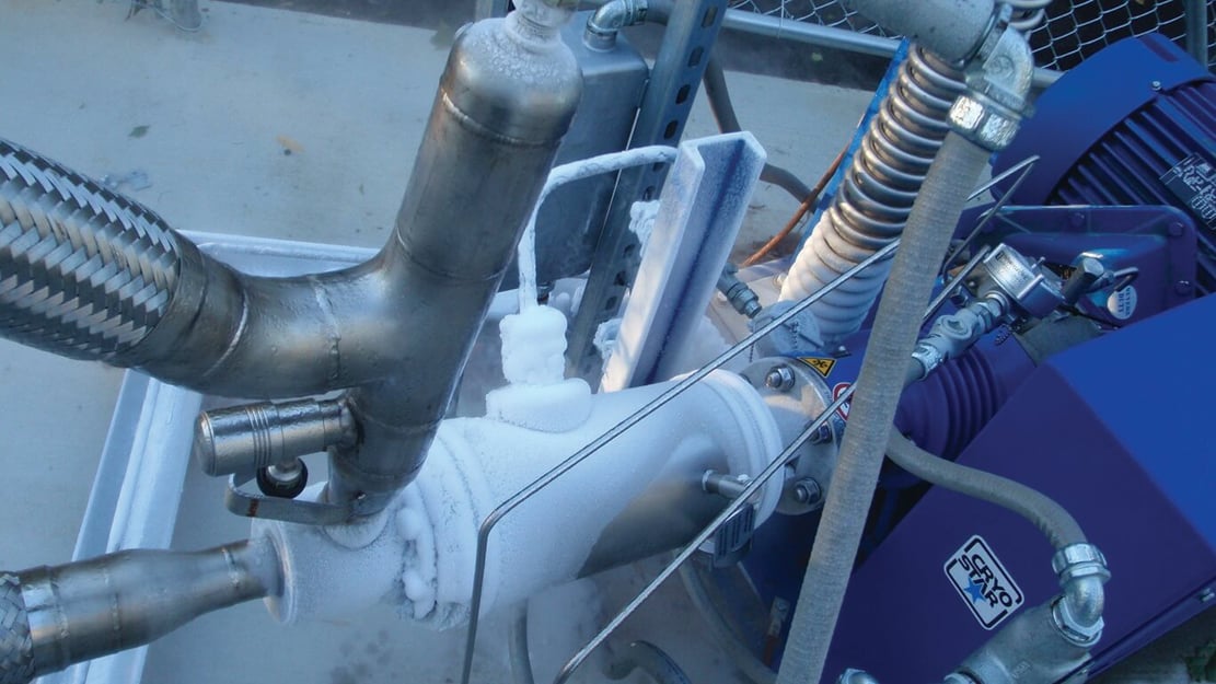 close up on a gas cylinder filling connector that is covered with frost