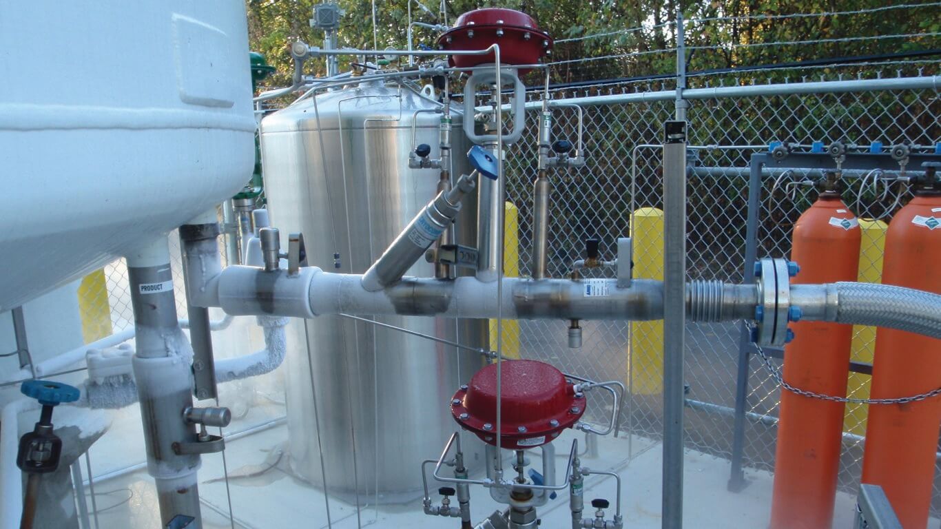 various gas cylinders and connectors used to fill them at the nexAir filling plant