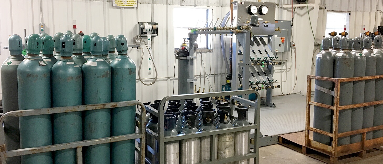various gas cylinders in gas packs and on gas pallets