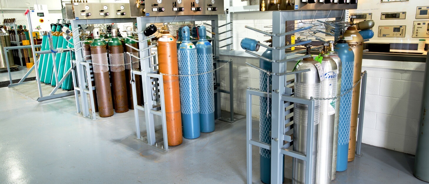 gas cylinders in racks being filled