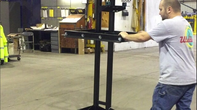 Man pushing a Welcdoa LowPro M1 6 Cylinder Cart