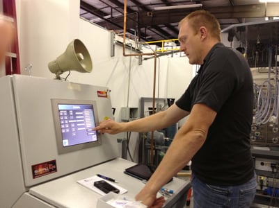 man using a gas cylinder filling control system 