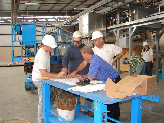 Neal, Nate, and Bud with Robert Parsons from Holston looking at blue prints