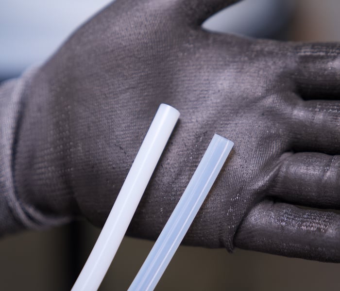 PTFE vs Post-Sintered PTFE in hand 600x700pixels