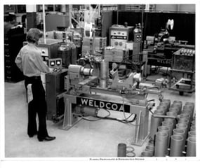 Man machining Weldcoa gas cylinders